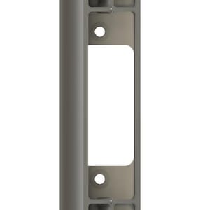 May include: A grey rectangular component with a central void and several rectangular recesses. Two circular holes are present. The object is likely a part of a larger structure or mechanism.