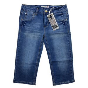 May include: Blue denim capri pants with a small tag attached to the waistband. The tag has the text "Distressed" on it.