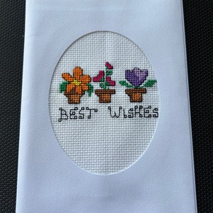 Tarjeta de felicitación en punto de cruz con los mejores deseos