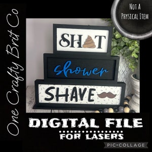 May include: A three-tiered black framed sign with the words "SHAT", "shower", and "SHAVE". The "SHAT" sign has a brown poop emoji. The "shower" text is blue, and the "SHAVE" sign has a brown mustache. The sign is a digital file for lasers.