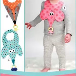 May include: A sewing pattern for Binkie Bibs, model P206 by Vanilla House Designs. The pattern features three bib designs: an orange fox, a pink elephant, and a teal elephant, each with a pacifier holder attachment at the bottom point.