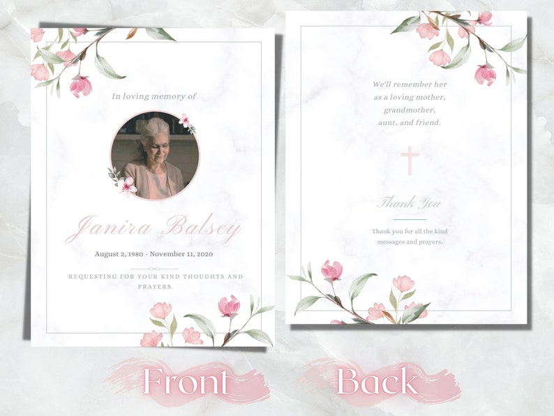 May include: A memorial card with a marble background and floral accents. The front features a photo, name, and dates. The back includes a cross and text: "We'll remember her as a loving mother, grandmother, aunt, and friend."