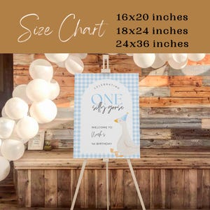 May include: A blue and white gingham welcome sign with a cartoon goose wearing a party hat. The sign reads "Celebrating One Silly Goose, Welcome to Nock's 1st Birthday".