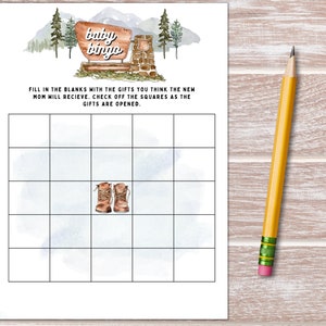 May include: A printable baby bingo card with a watercolor background featuring a mountain scene and a sign that says "baby bingo". The card has a 5x5 grid with blank squares for players to fill in with gifts they think the new mom will receive.
