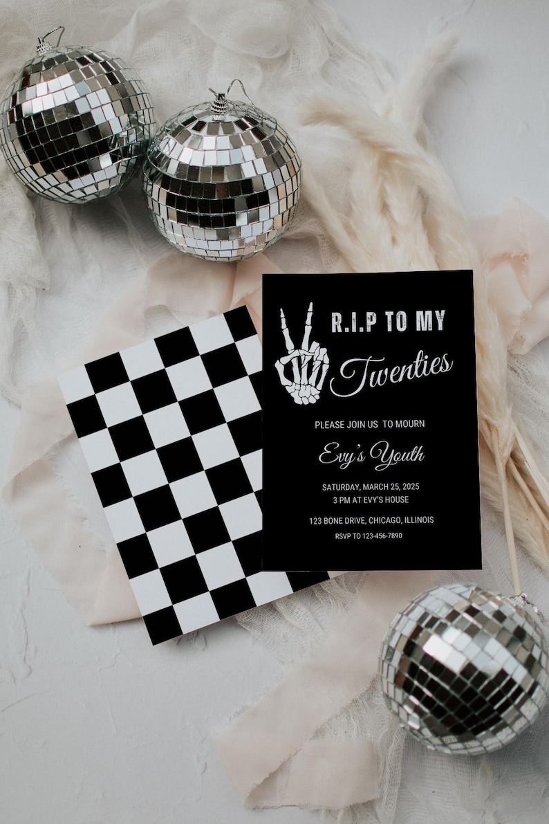 May include: A black and white checkered pattern card with a black invitation card on top. The invitation card has a white skeleton hand making a peace sign and the text "R.I.P TO MY Twenties" in white. The text "PLEASE JOIN US TO MOURN Evy's Youth" is also in white. The invitation card also includes the date, time, location, and RSVP information.