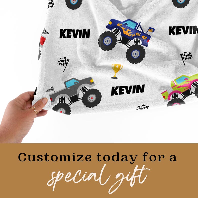 May include: White fleece blanket with a repeating pattern of monster trucks, checkered flags, and the name "Kevin".