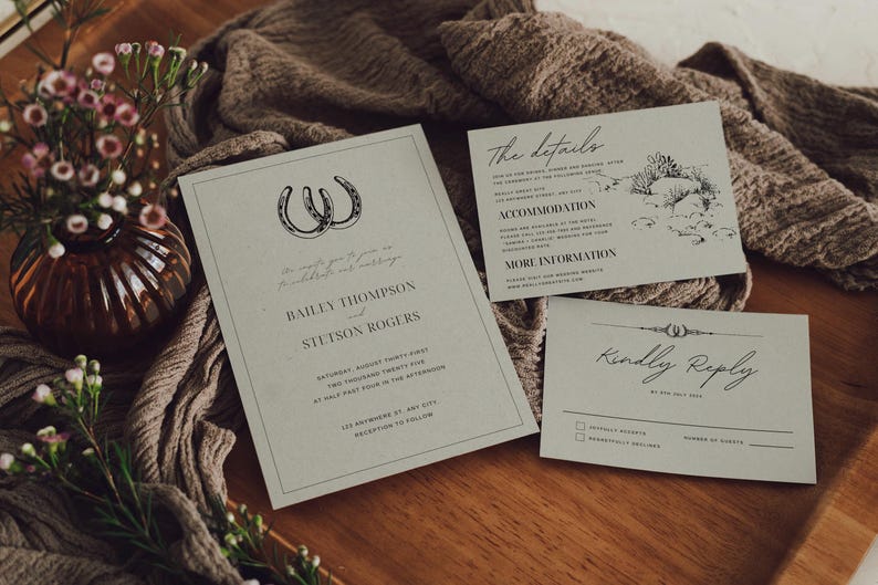 May include: A wedding invitation suite with a rustic theme. The main invitation features a horseshoe design and the names "Bailey Thompson" and "Stetson Rogers". The details card includes information about the wedding venue and accommodation. The RSVP card has a "Kindly Reply" heading and a space for guests to indicate their attendance.