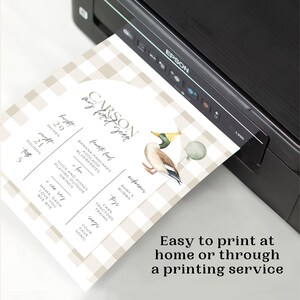 May include: A printable first birthday party invitation for a boy named Carson. The invitation features a brown and white gingham pattern, a watercolour illustration of a duck wearing a party hat, and a list of Carson's favourite foods, toys, and songs. The invitation also includes Carson's height and weight at one year old.