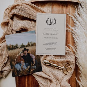 May include: A rustic wedding invitation with a brown background and a black and white illustration of two horseshoes. The text on the invitation reads "The happy couple invites you to a celebration of their marriage" followed by the names "Bailey Thompson and Stetson Rogers". The date and time of the wedding are listed as "Saturday, August Thirty First, Two Thousand Twenty Five at Half Past Four in the Afternoon". The location is listed as "123 Anywhere St, Any City". The invitation concludes with "Reception to Follow".