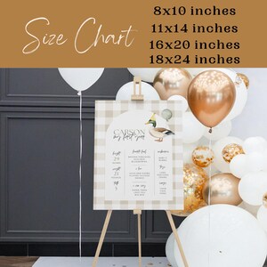May include: A printable sign for a baby's first birthday party. The sign is decorated with a brown and white gingham pattern and features a cartoon duck with a party hat. The sign includes the baby's name, "Carson", and a list of milestones for the first year of life. The sign is available in four sizes: 8x10 inches, 11x14 inches, 16x20 inches, and 18x24 inches.