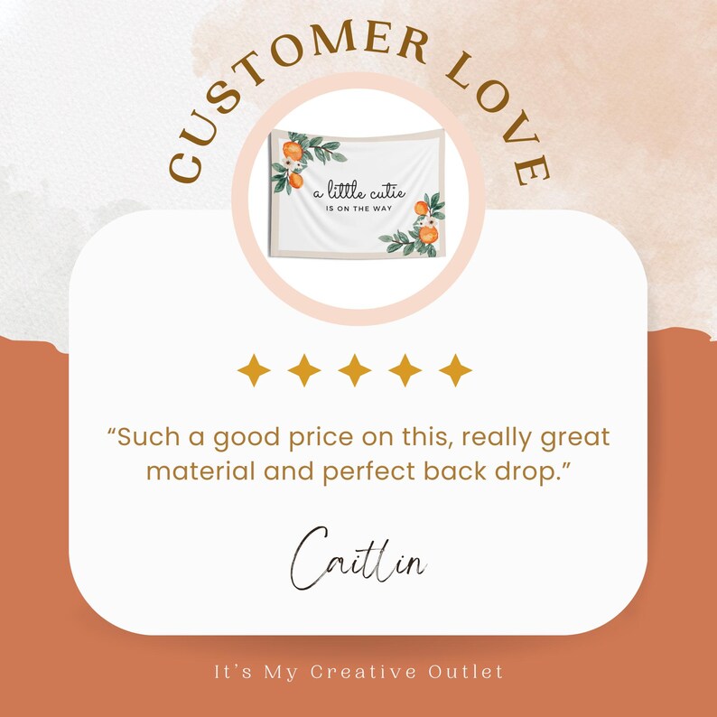 May include: A white tapestry with a floral design featuring orange blossoms and green leaves. The tapestry has the text "a little cutie is on the way" printed on it. The tapestry is hanging on a wall with a peach-colored background. Five gold stars are below the tapestry. The text "CUSTOMER LOVE" is above the tapestry and the text "It's My Creative Outlet" is below the tapestry.