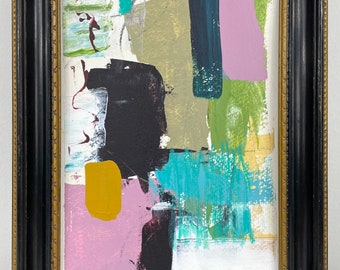 May include: Abstract painting in a black frame with a gold trim. The painting features a variety of colors, including black, white, green, blue, pink, and yellow. The artist's signature, "Linda S. Blackley", is visible in the bottom right corner.