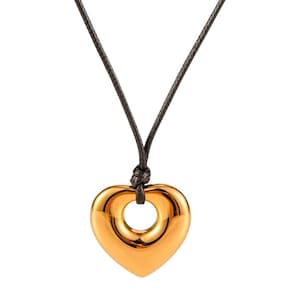 High polish heart on a string necklace with adjustable black cord , available in gold or silver color metal