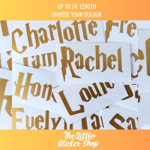 May include: Gold vinyl stickers with names written in a gothic font. The stickers are on white paper and are up to 24 inches in length. The text on the image reads "UP TO 24" LENGTH CHOOSE YOUR COLOUR".