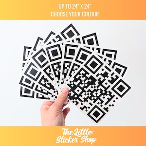 May include: A hand holds a fan of black and white QR code stickers. The stickers are arranged in a fan shape, with the largest sticker at the bottom and the smallest sticker at the top. The stickers are all the same size, and they are all printed on white paper. The text "UP TO 24" x 24" CHOOSE YOUR COLOUR" is visible at the top of the image. The text "The Little Sticker Shop" is visible at the bottom of the image.