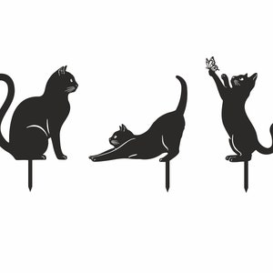 May include: Set of three black metal cat garden stakes. One cat is sitting, another stretching, and the third is reaching for a butterfly. Each stake has a pointed end for easy placement in the garden.
