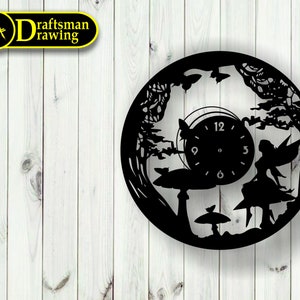 May include: Black and white silhouette wall clock featuring a fairy sitting on a mushroom with a forest background. The clock face is visible with numbers 12, 3, 6, and 9.