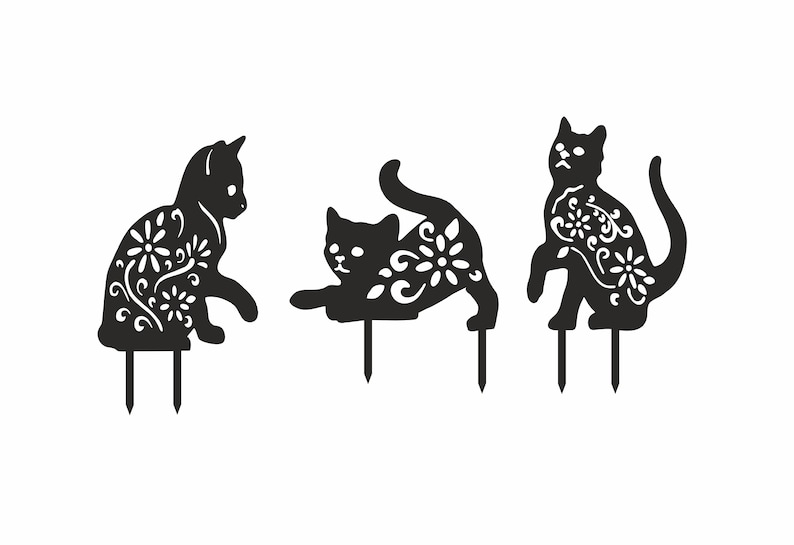 May include: Three black metal cat garden stakes in different poses. Each cat has a floral design cut out of its body. The stakes are designed to be placed in the ground for outdoor decoration.