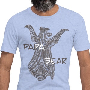 May include: Light blue t-shirt with a gray illustration of a bear with the text "Papa Bear" printed on the front.