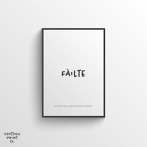 May include: A black framed print with the Scottish Gaelic word "Fàilte" written in black script. The text "Scottish Gaelic word meaning 'welcome'" is written below the word.