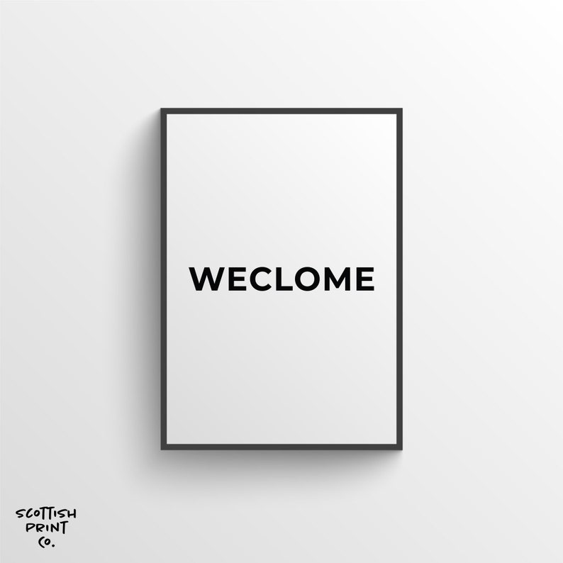May include: Black and white framed print with the word "WECLOME" in all caps.