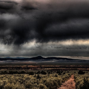 In New Mexico Scene, a Fall Storm Rages Across the High Desert Plain | New Mexico Art as Panoramic Photo, Canvas Print | Santa Fe-Taos Decor