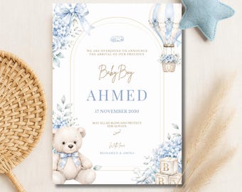 May include: A rectangular birth announcement card featuring a watercolour illustration of a teddy bear with a blue plaid bow, a hot air balloon, and blue floral accents. The text reads: We are overjoyed to announce the arrival of our precious Baby Boy AHMED 17 November 2030 May Allah bless and protect him always. With love MOHAMED & AMINA.