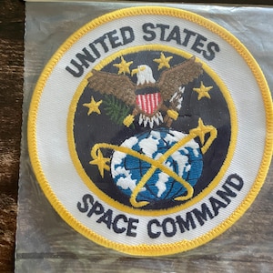 May include: A set of three ceramic mugs with a speckled, matte finish. The mugs are in shades of cream, light brown, and dark brown. Each mug has a simple, minimalist design, perfect for coffee or tea.