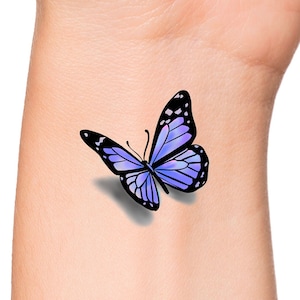 This is a temporary tattoo of a purple 3D butterfly. This temporary tattoo is approximately 1 1/2 inches long.