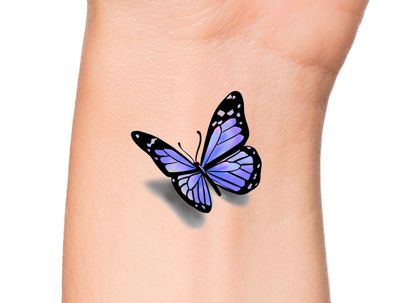 This is a temporary tattoo of a purple 3D butterfly. This temporary tattoo is approximately 1 1/2 inches long.