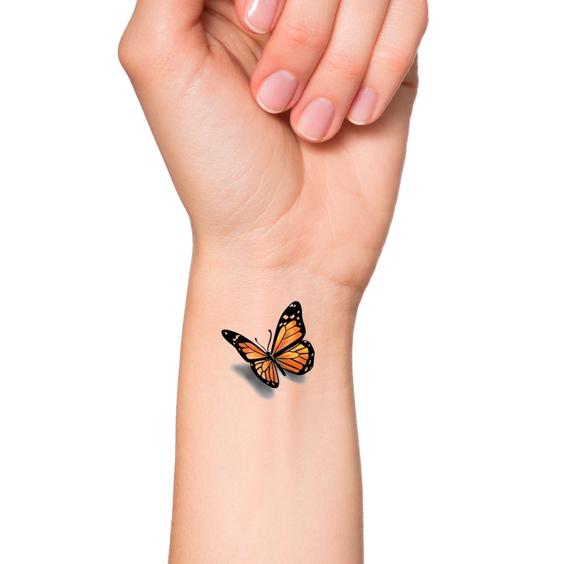 This is a temporary tattoo of a orange 3D butterfly. This temporary tattoo is approximately 1 1/2 inches long.