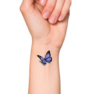 This is a temporary tattoo of a purple 3D butterfly. This temporary tattoo is approximately 1 1/2 inches long.