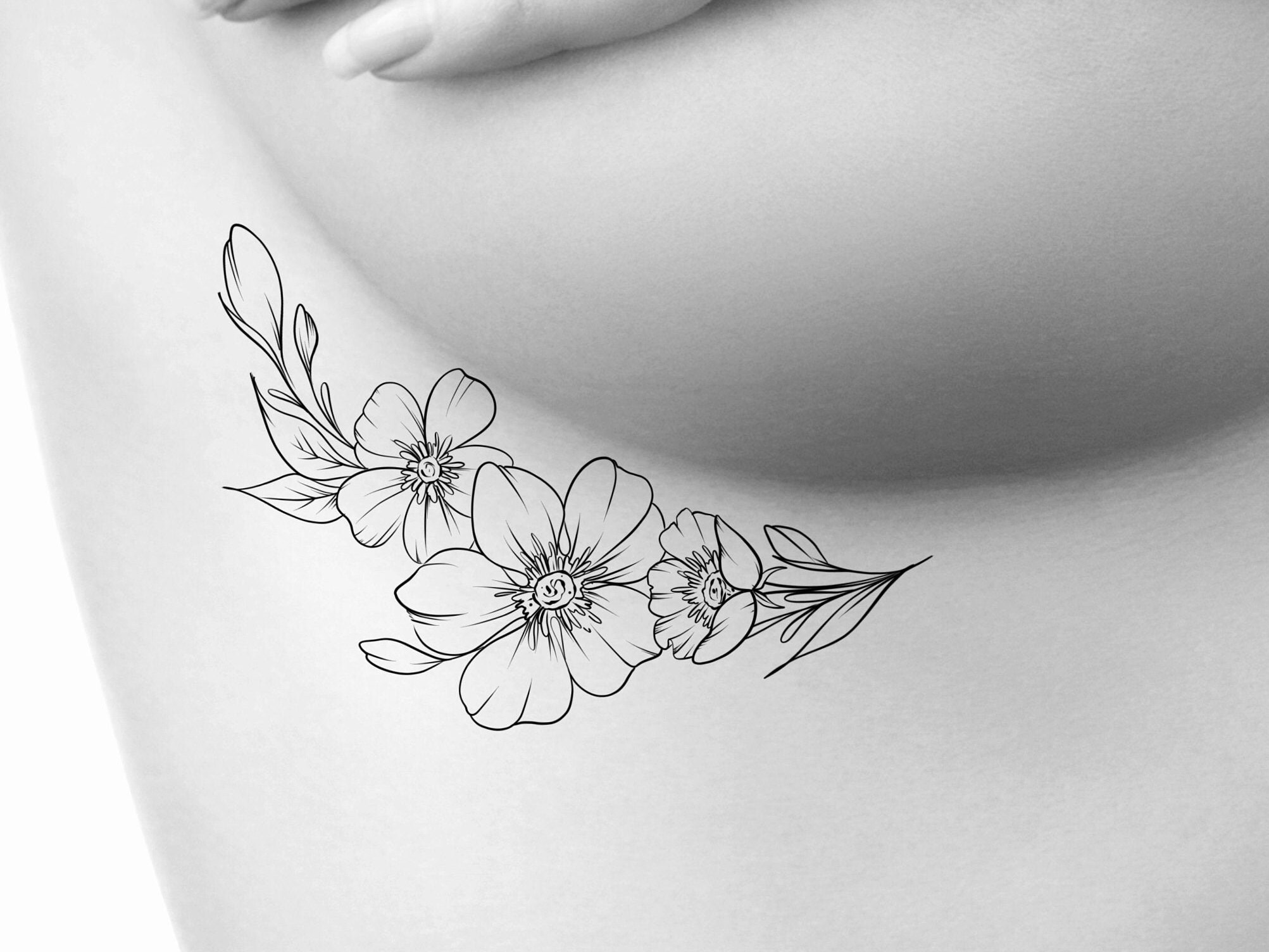 Floral underboob tattoos