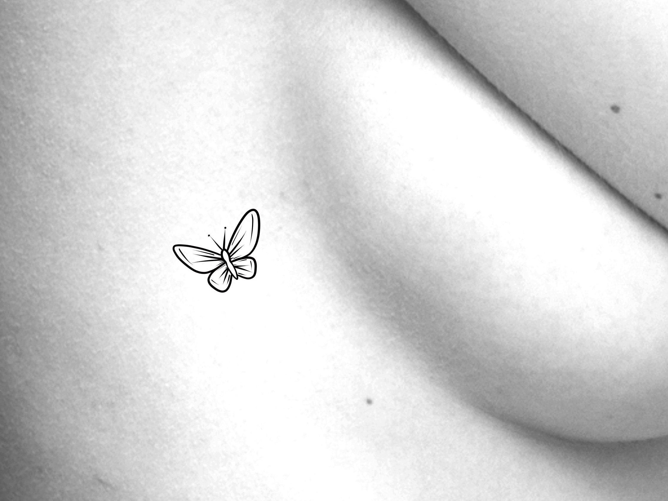 Beautiful Butterfly Tattoos on the Breast