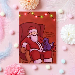 Carte de Noël drôle | chat sur les genoux du père Noël | Cadeau de Noël TikTok Meme pour petit ami, mari, petite amie, fils, fille - elle ou lui