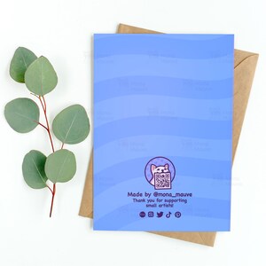 May include: Blue card with a white cat holding a QR code. The text reads "Made by @mona_mauve Thank you for supporting small artists!" with social media icons below.