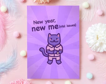 以下が含まれることがあります： 紫色の背景に「New year, new me (ntal issues)」というテキストが入ったグリーティングカード。ピンク色の服を着た漫画の猫が描かれています。背景は花とポンポンで飾られています。