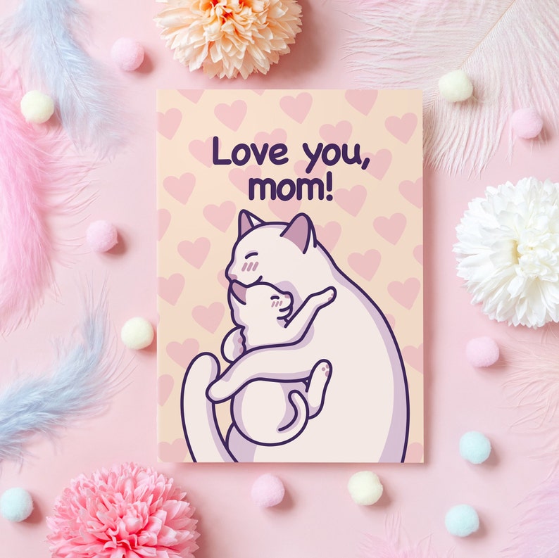 Pode incluir: Um cart&atilde;o rosa claro com um fundo amarelo claro e um gato branco abra&ccedil;ando um gato branco menor. O cart&atilde;o tem cora&ccedil;&otilde;es rosa no fundo e o texto "Love you, mom!" em texto roxo.