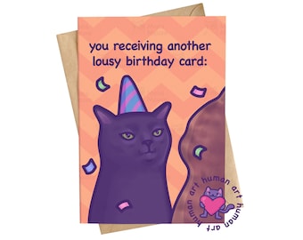 May include: A greeting card with a light orange chevron background featuring a dark purple cat wearing a blue and pink striped party hat. The text reads, you receiving another lousy birthday card: with scattered colorful confetti pieces.
