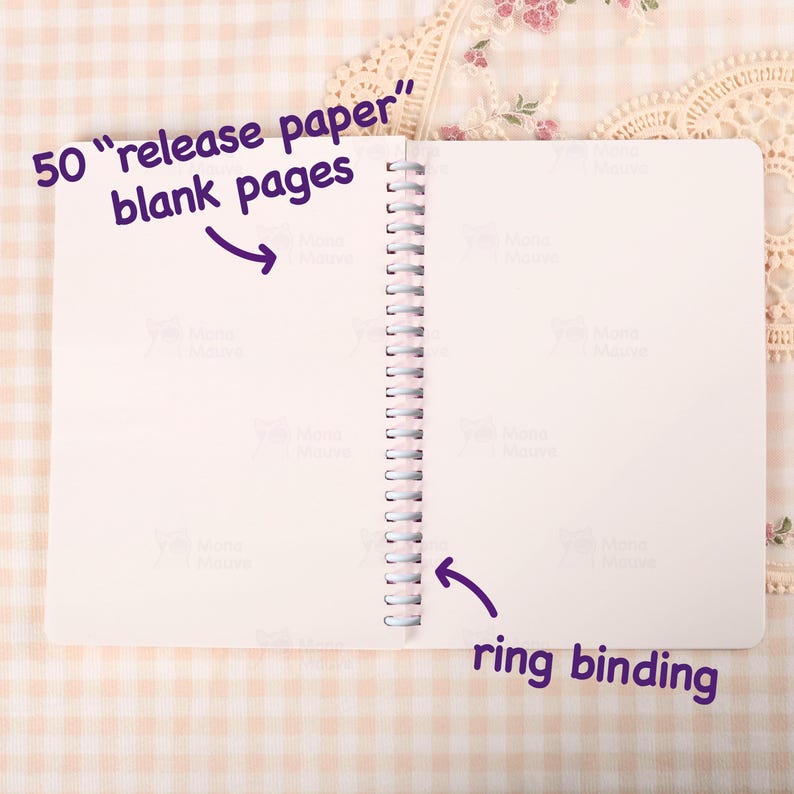 May include: Open notebook with 50 blank pages and ring binding. Text on the image reads "50 release paper blank pages" and "ring binding". The pages are white.