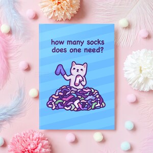 Carte de Noël drôle de chat | De combien de chaussettes a-t-on besoin ? | Cadeau mème pour le meilleur ami, petit ami, mari, papa, maman, frère - elle ou lui