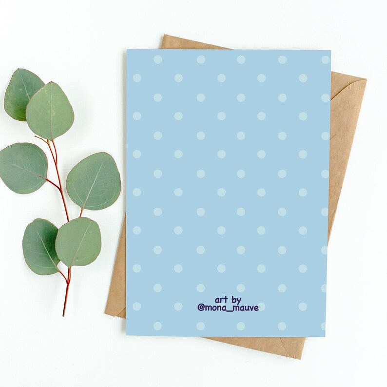 May include: A light blue card with white polka dots and the text "art by @mona_mauve" in purple.