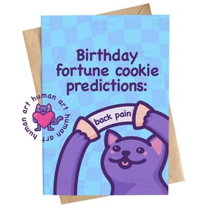 May include: A greeting card with a light blue checkered background featuring a purple cat holding a fortune cookie strip that reads back pain. The text above the cat reads Birthday fortune cookie predictions: in dark purple lettering.