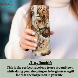 May include: A 20 ounce stainless steel tumbler with a brown and white horse illustration. The horse has a brown bridle and a brown and white mane. The background is a brown and white abstract design.