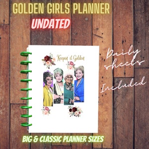 May include: A white planner with a green spiral binding. The cover features a colorful illustration of the Golden Girls with the text "Keepin' it Golden." The planner includes daily sheets and is available in big and classic sizes.