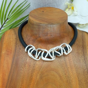 Chunky bold stunning intertwined chain statement necklace. Unique rubber with magnetic closure .