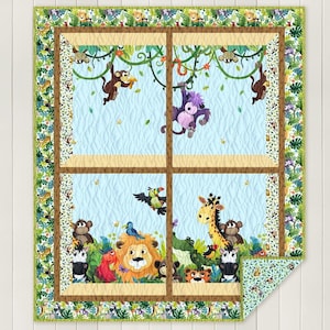 May include: A colorful quilt featuring a jungle scene with cartoon animals. The quilt has a light blue background with monkeys, a giraffe, a lion, and other animals. The border has a green and brown floral pattern.