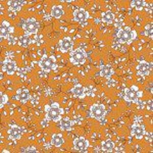 May include: A seamless pattern featuring small white flowers with light blue centers on a mustard yellow background. The flowers are arranged in a repeating pattern with small branches and leaves.