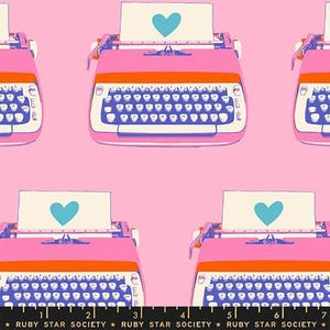 May include: A repeating pattern of pink and orange typewriters with blue keyboards and a sheet of paper with a teal heart. The background is a solid pink color. The text "RUBY STAR SOCIETY" is at the bottom.