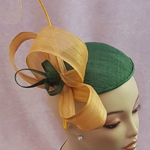 New women's Saucer Percher Hat by Alexander & Hallatt in Dark Olive Green Sinamay Green Sinamay swirls with Gold Abaca